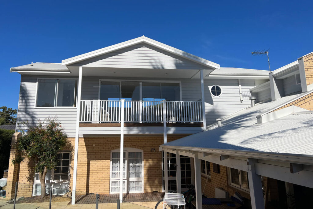 Front elevation of second story addition to brick house